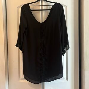 Black ASTR dress with scoop back and lace detailing. Size medium.